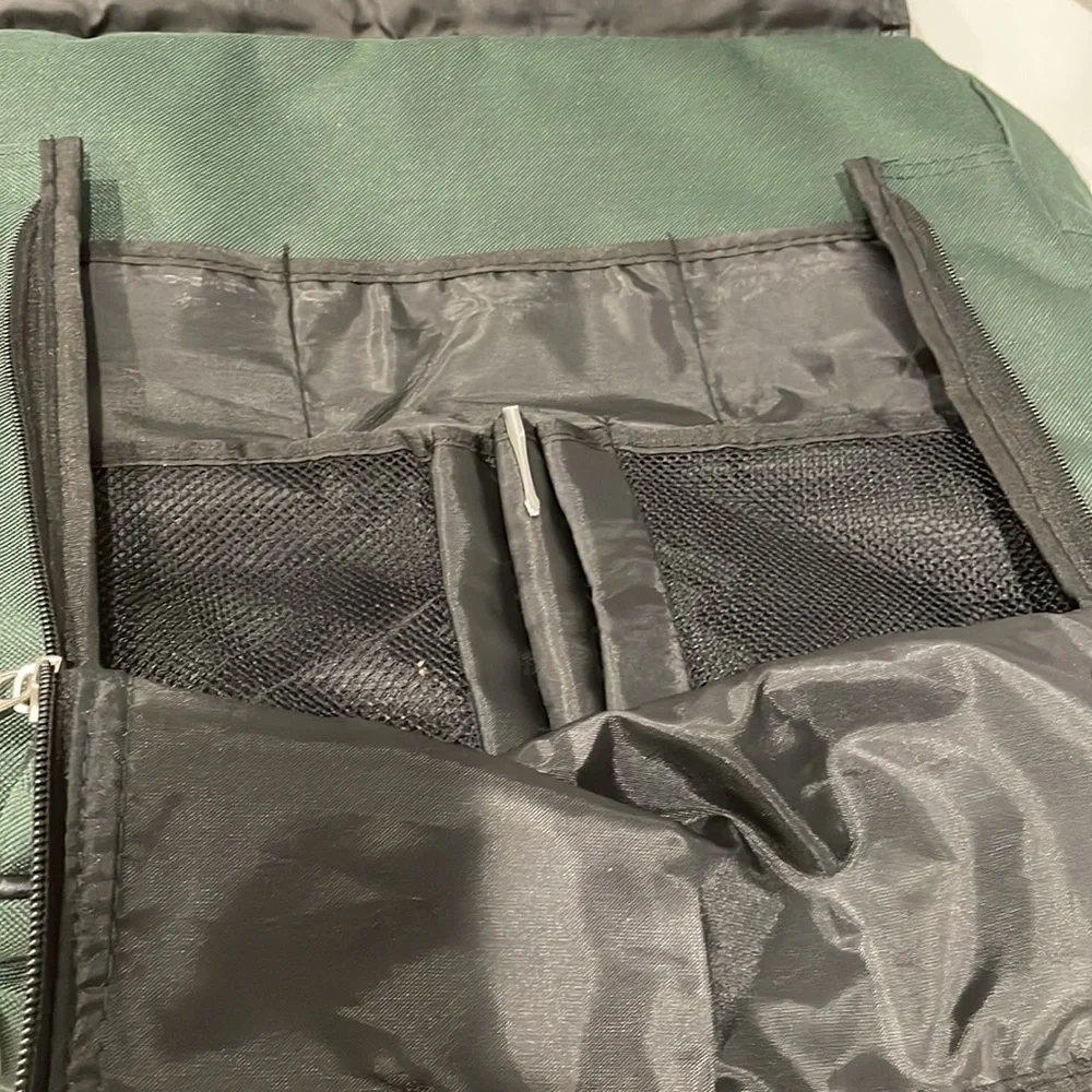 Dark green canvas briefcase with laptop sleeve and multiple pockets. NWT